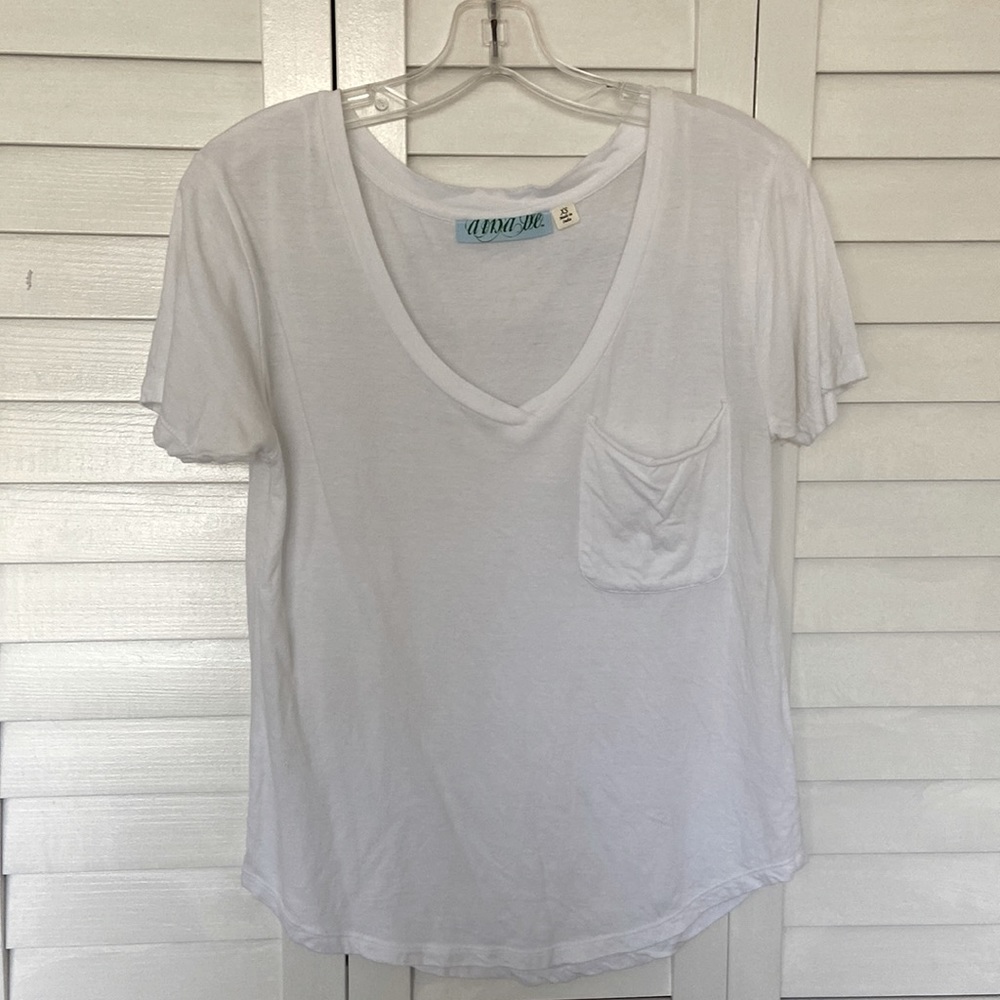 Francesca’s collection white v-neck with pocket tshirt. Size XS, fits like S-M